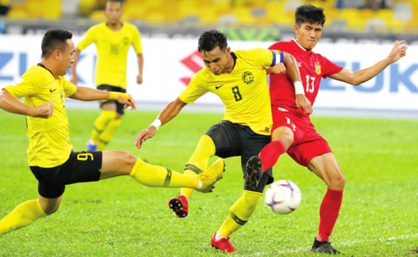 Malaysia leave it late to down Laos 3-1
