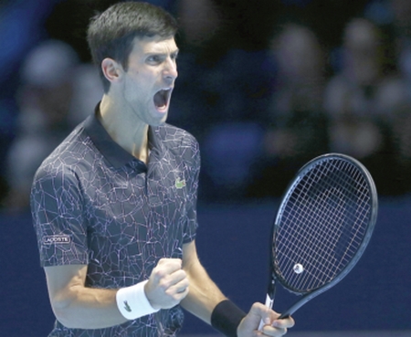 Djokovic crushes Isner  in ATP Finals opener