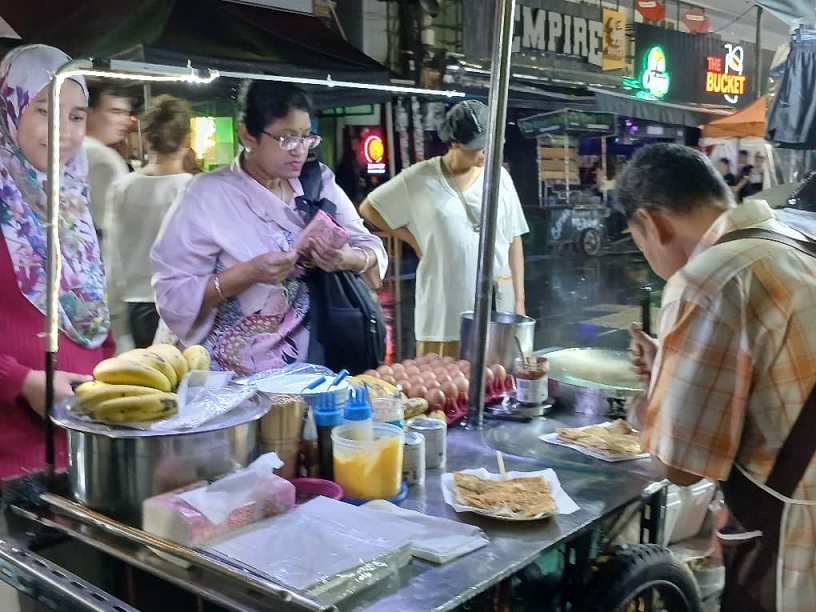 Familiar food: Roti canai sold at Bangkok but with different sauces than the ones in Malaysia.