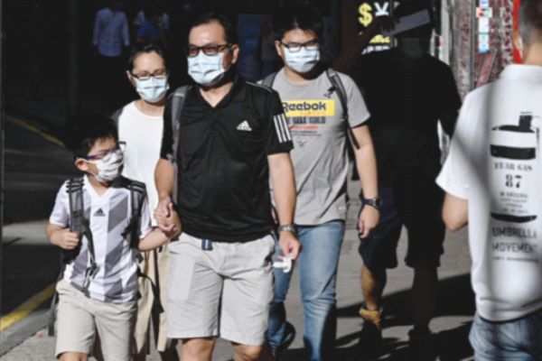 HK orders mandatory mask wearing to combat new wave