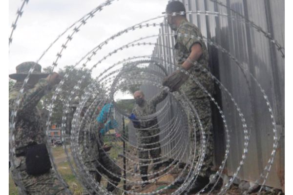 Barbed wire goes up at Penampang kongsi under Emco