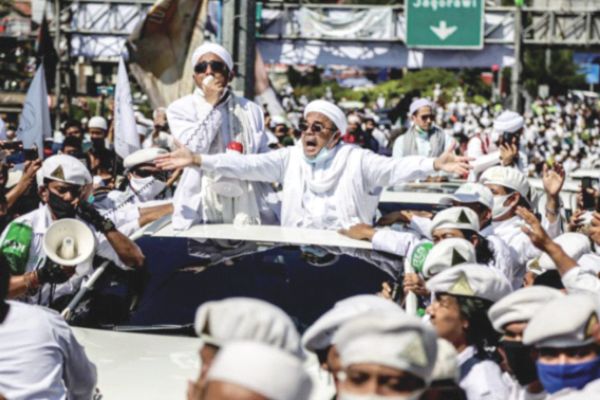 Indonesian cleric apologises for rallies amid questions over his Covid-19 test