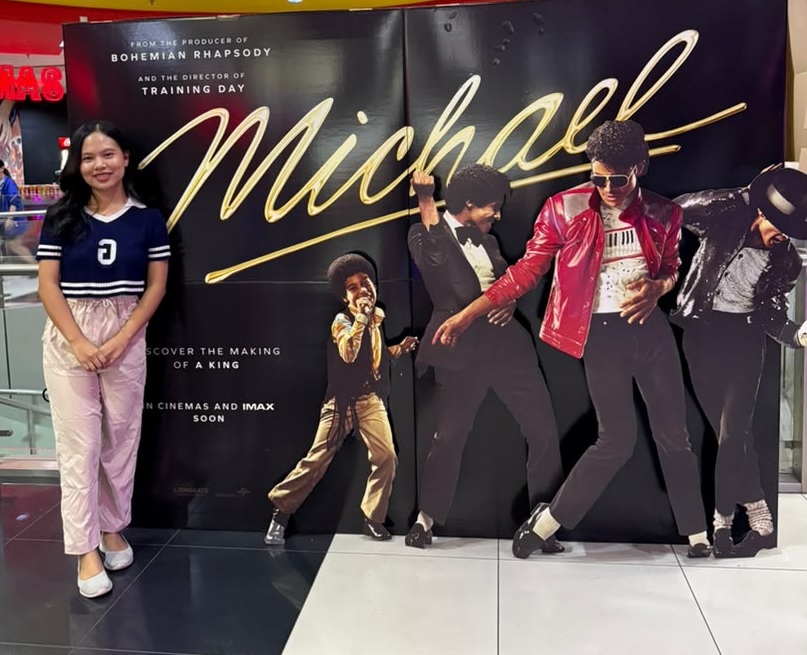 Geena posing beside a poster for the Michael Jackson movie at a cinema in one of Kota Kinabalu’s shopping malls. (Pic: Provided)