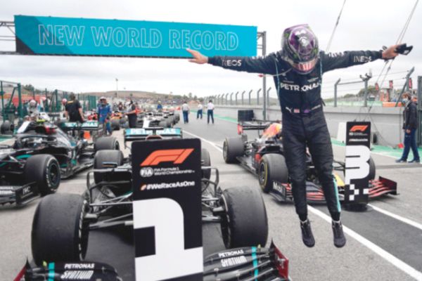 Lewis Hamilton makes record-breaking triumph
