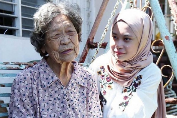 Let me live like everyone else, says stateless Muslim woman raised by Chinese adoptive mother 