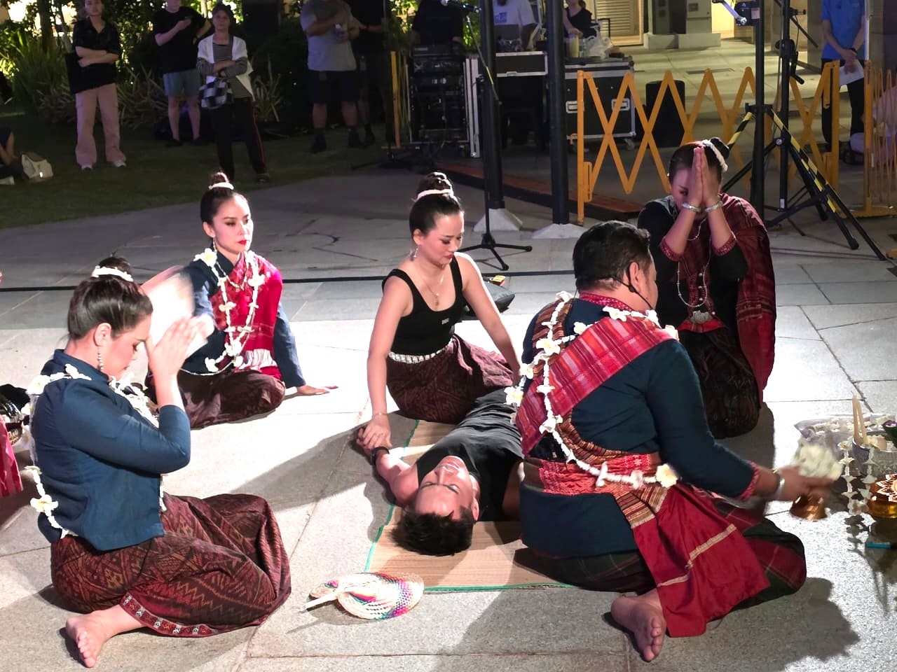A man lies at the centre of the Mor Lam Phil healing ceremony as spirit healers invoke the Phii Fa through sacred chants, music, and ritual. – Photo T. Selva 
