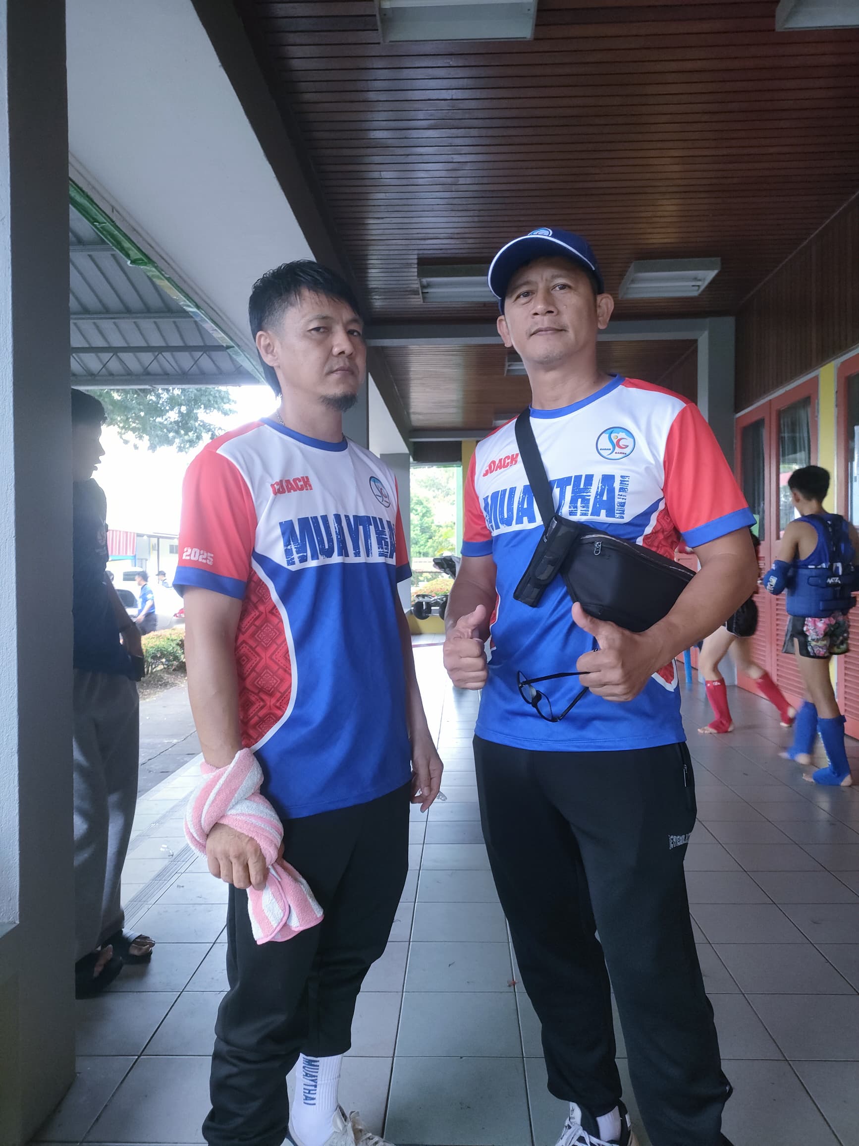 Rozaimy Ahad, the coach (left) with Tambuakar president Jerry Embang