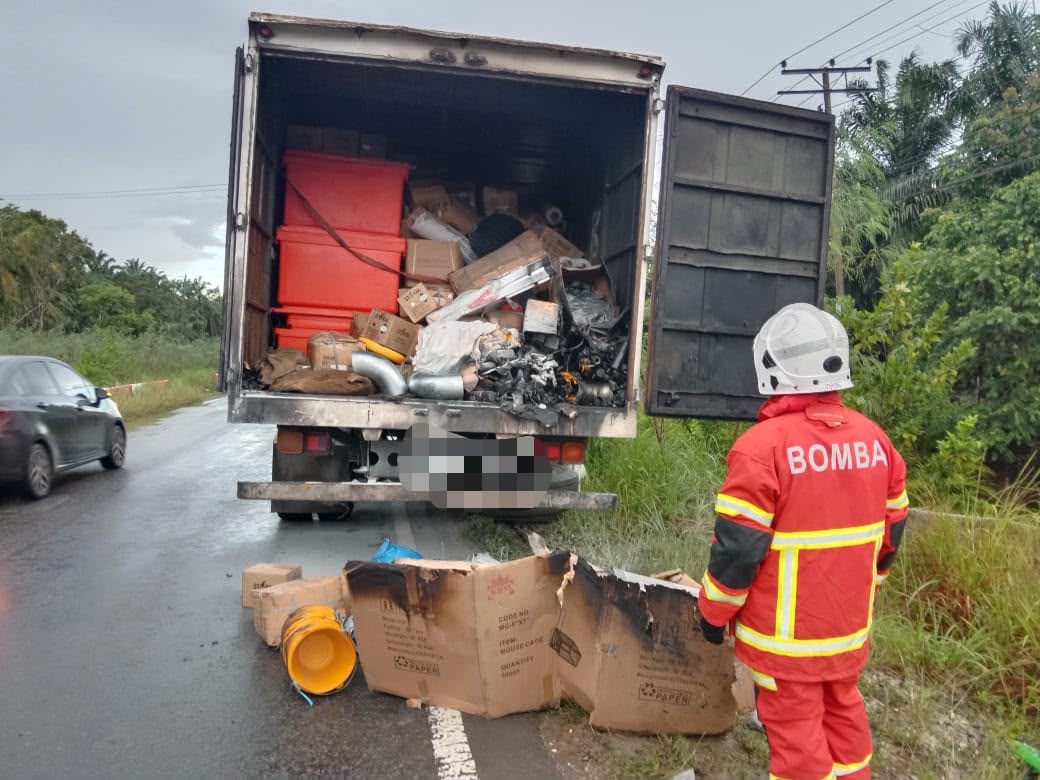 Container carrying goods catches fire in Sukau